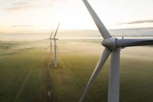 Three wind turbines in operation — blade structural integrity is central to asset performance and insurance liability assessment